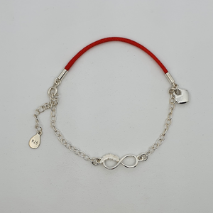 Infinity cord bracelet with feather