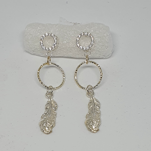 Silver earrings with feathers